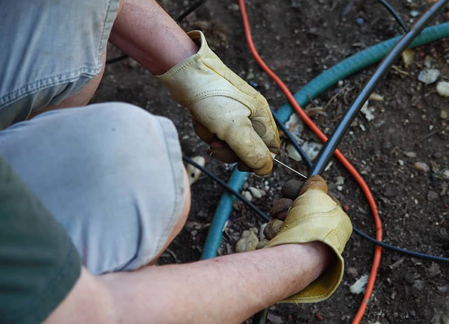 Homeowner-works-on-sprinkler-system